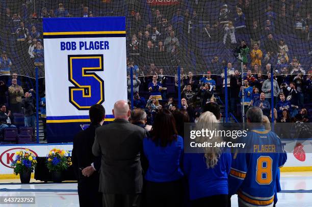 Bob Plager and his family watch as Plager's number is hung in the rafters during Plager's number retirement ceremony prior to a game between the...