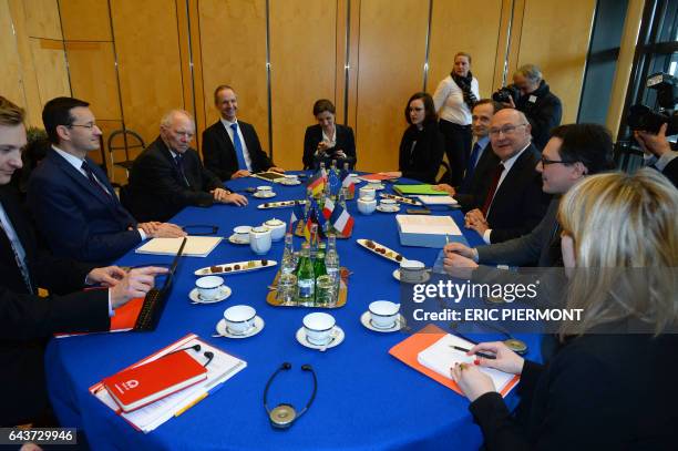 French Finance and Economy Minister Michel Sapin , German Finance Minister Wolfgang Schaeuble and Polish deputy Prime Minister, Minister of Economic...