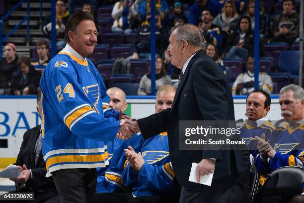 Bernie Federko greets Bob Plager during Plager's number retirement ceremony prior to a game between the Toronto Maple Leafs and the St. Louis Blues...