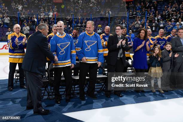 Barret Jackman greets Bob Plager during Plager's number retirement ceremony prior to a game between the Toronto Maple Leafs and the St. Louis Blues...