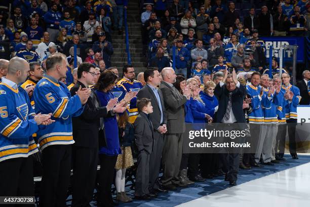 Bob Plager salutes the fans during Plager's number retirement ceremony prior to a game between the Toronto Maple Leafs and the St. Louis Blues on...