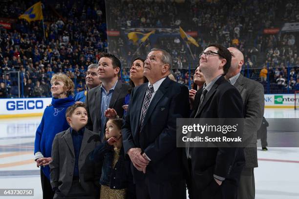 Bob Plager and his family watch as Plager's number is hung in the rafters during Plager's number retirement ceremony prior to a game between the...