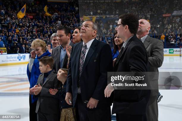 Bob Plager and his family watch as Plager's number is hung in the rafters during Plager's number retirement ceremony prior to a game between the...