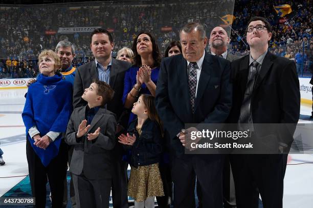 Bob Plager and his family watch as Plager's number is hung in the rafters during Plager's number retirement ceremony prior to a game between the...