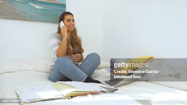 beautiful woman making a phone call - estudando stock pictures, royalty-free photos & images