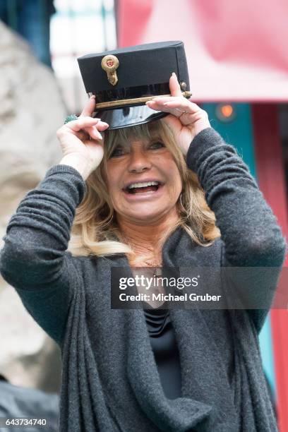 Actress Goldie Hawn jokes around during an autograph session after a press conference where Richard Lugner presented her as his guest for this year's...