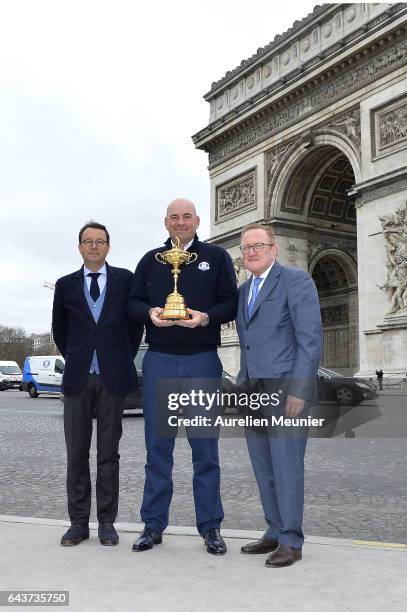 Pascal Grizot, Thomas Bjorn, Captain for the 2018 Ryder Cup in France and Richard Hills pose with the Ryder Cup Trophy in front of the Arc De...