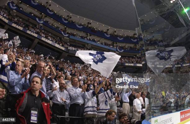 Fans of the Toronto Maple Leafs stand and applaud in appreciation during game six of the Eastern Conference finals against the Carolina Hurricanes at...