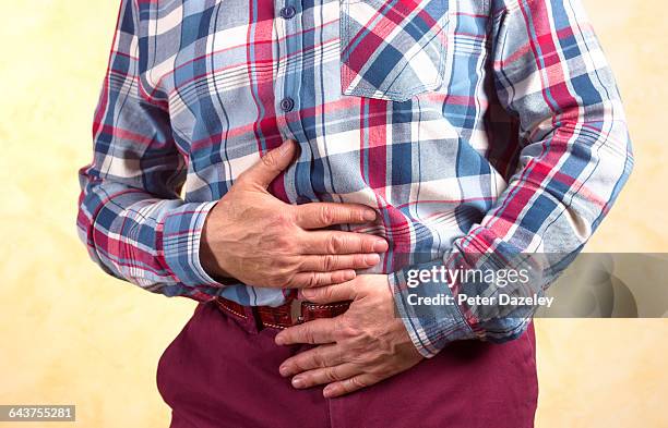 man with stomach pain - irritable bowel syndrome stock pictures, royalty-free photos & images