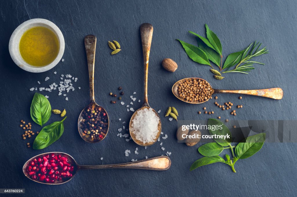 Herbs and spices on slate.