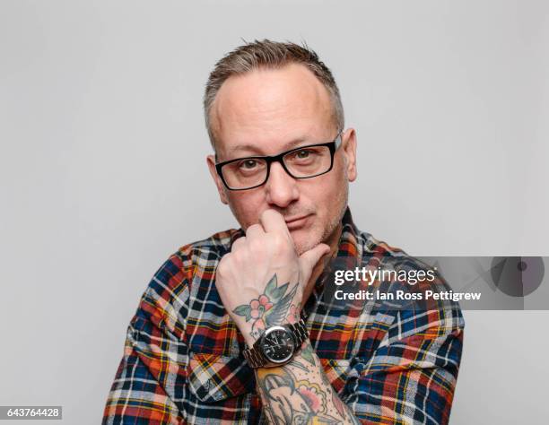 portrait of middle-aged man with black glasses, short hair and greying beard. wearing plaid shirt. - högt hårfäste bildbanksfoton och bilder