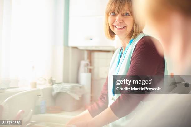 careworker - meals on wheels stock pictures, royalty-free photos & images