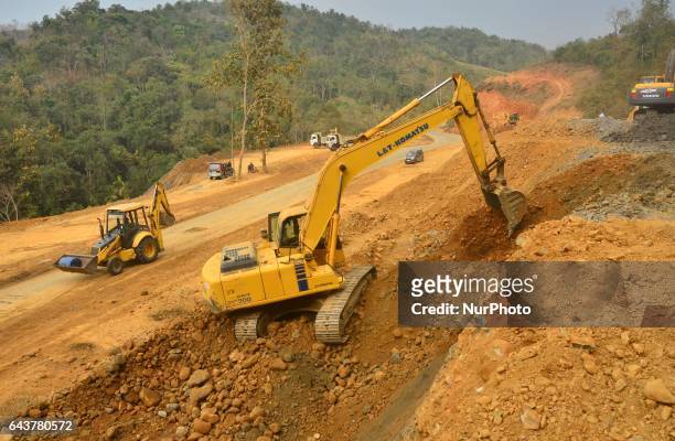 Excavator works in widening of road for Asian Highway 1 to Four Lane from Dimapur to Zubza road at Medzhiphema, outskirt of Dimapur, India north...