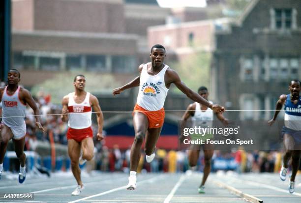 Carl Lewis of the Santa Monica Track Team competes in a 100 meter competition track and field event circa 1984.