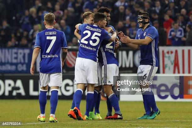 Alessandro Schoepf of Schalke celebrates his team's first goal with team mates during the UEFA Europa League Round of 32 second leg match between FC...