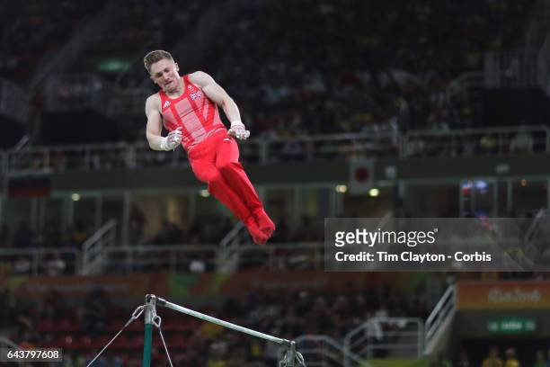 Gymnastics - Olympics: Day 3 Nile Wilson of Great Britain performing his Horizontal Bar routine during the Artistic Gymnastics Men's Team Final at...