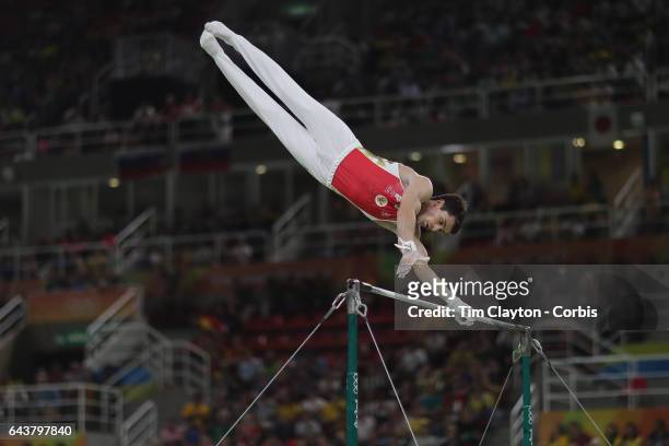 Gymnastics - Olympics: Day 3 Nikolai Kuksenkov of the Russian Federation performing his Horizontal Bar routine during the Artistic Gymnastics Men's...