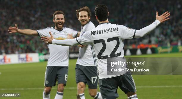 Henrikh Mkhitaryan of Manchester United celebrates scoring their first goal during the UEFA Europa League Round of 32 second leg match between AS...