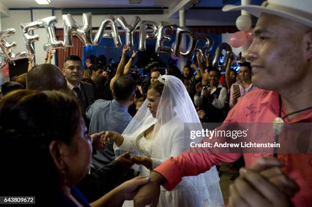 An older Mexican couple celebrates their wedding in the community meeting hall of a church in the neighborhood of Sunset Park on February 18, 2017 in...