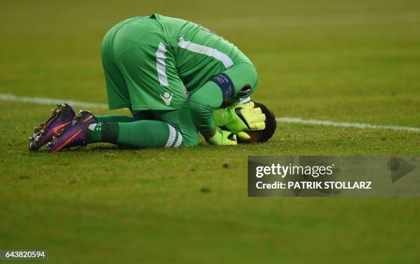 S goalkeeper Panagiotis Glykos reacts during the UEFA Europa League round of 32 second-leg football match FC Schalke 04 v PAOK Thessaloniki in...