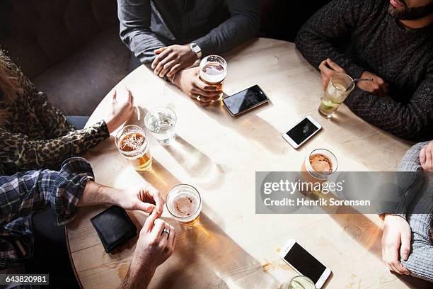 group of friends have beers - table top view stock-fotos und bilder