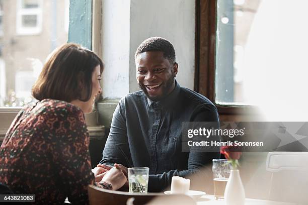 a couple together in a pub - couple discussion stock pictures, royalty-free photos & images