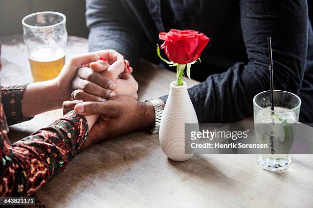 a couple holding hands - dating stock pictures, royalty-free photos & images