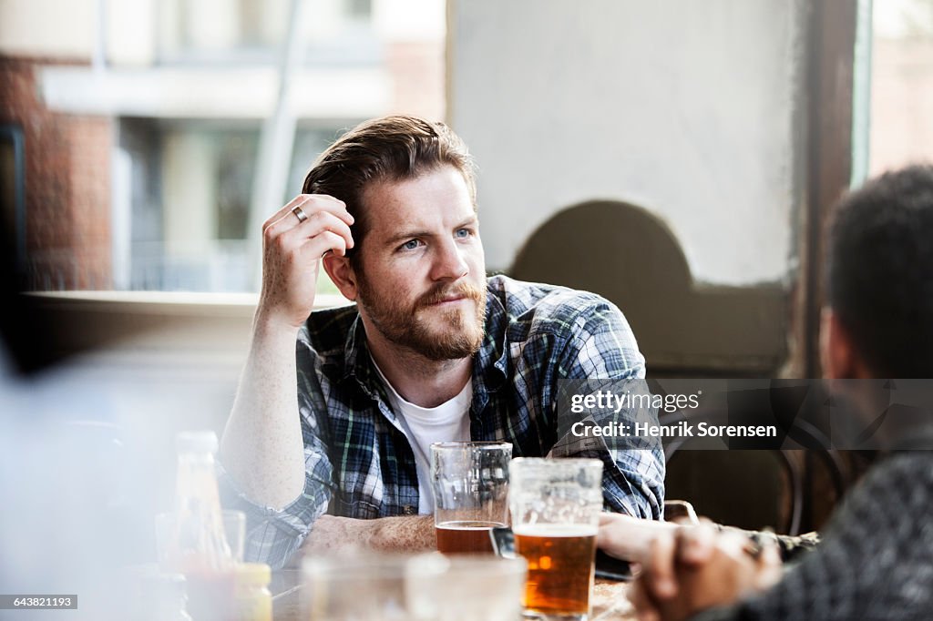 Man in conversation in a pub