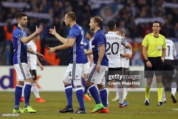 Matija Nastasic, Holger Badstuber and Johannes Geis of Schalke react after the UEFA Europa League Round of 32 second leg match between FC Schalke 04...