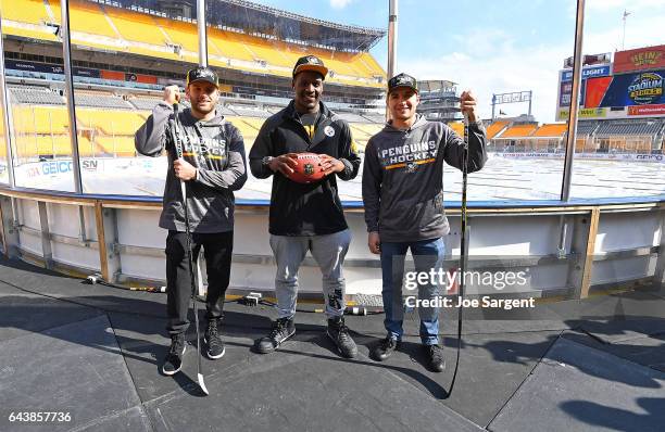 Bryan Rust of the Pittsburgh Penguins, Arthur Moats of the Pittsburgh Steelers and Conor Sheary pose for a photo during media availability for the...