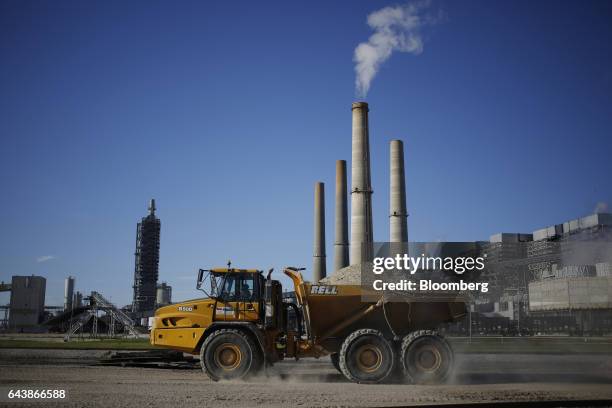 Dump truck drives through the grounds of the NRG Energy Inc. WA Parish generating station in Thompsons, Texas, U.S., on Thursday, Feb. 16, 2017. The...