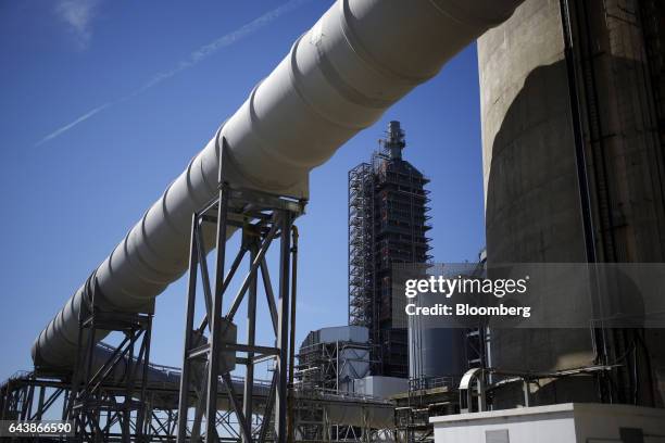 Pipe carries emissions to the Petra Nova Carbon Capture Project at the NRG Energy Inc. WA Parish generating station in Thompsons, Texas, U.S., on...