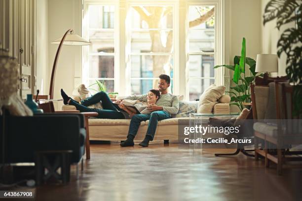 home is where you're most comfortable - living room young couple stock pictures, royalty-free photos & images