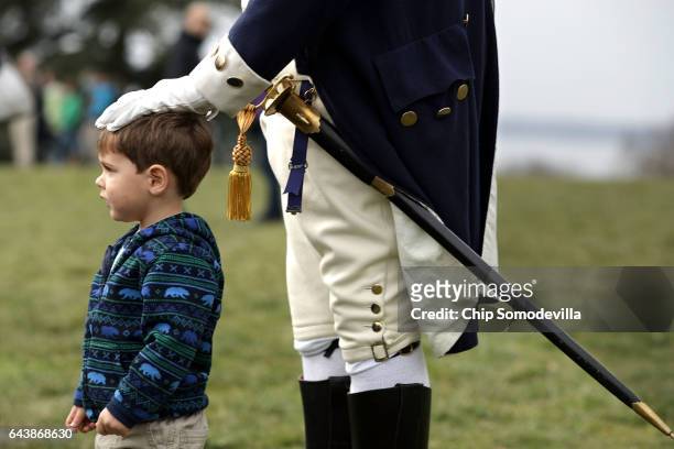 Dean Malissa portrays President George Washington as he poses for photogrpahs with young vistors at the Mount Vernon Estate February 22, 2017 in...
