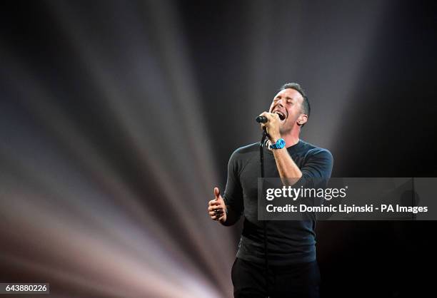 Coldplay's Chris Martin performs a tribute to George Michael on stage at the Brit Awards at the O2 Arena, London.