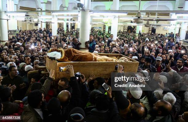 People carry the coffin of founder of Islamic group Al-Gama Al-Islamiyya Sheikh Omar Abdel-Rahman, who was detained in the United States, during...