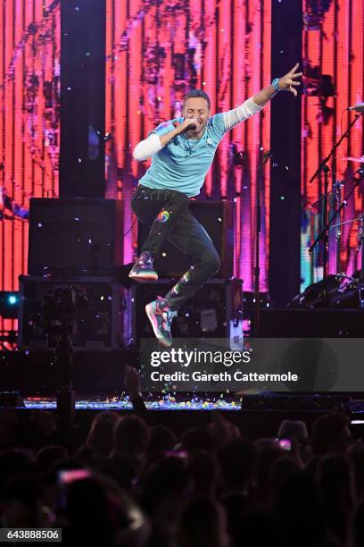Chris Martin of Coldplay performs with The Chainsmokers on stage at The BRIT Awards 2017 at The O2 Arena on February 22, 2017 in London, England.