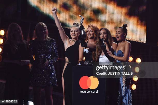 Perrie Edwards, Jesy Nelson, Jade Thirlwall, Leigh-Anne Pinnock of British girl group Little Mix celebrate with the award for a British single for...