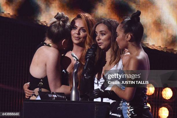 Perrie Edwards, Jesy Nelson, Jade Thirlwall, Leigh-Anne Pinnock of British girl group Little Mix accept the award for a British single for 'Shout Out...