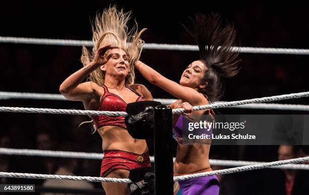 Charlotte Flair and Bayley fight during to the WWE Live Duesseldorf event at ISS Dome on February 22, 2017 in Duesseldorf, Germany.