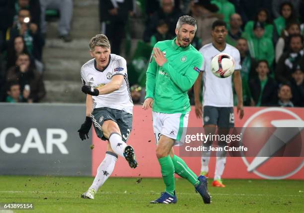 Bastian Schweinsteiger of Manchester United and Fabien Lemoine of Saint-Etienne in action during the UEFA Europa League Round of 32 second leg match...