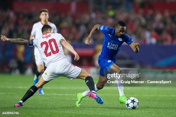 Leicester City's Ahmed Musa evades the challenge of Sevilla's Vitolo during the UEFA Champions League Round of 16 first leg match between Sevilla FC...