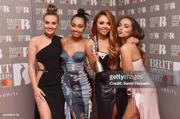 Perrie Edwards, Leigh-Anne Pinnock, Jesy Nelson and Jade Thirlwall of Little Mix pose with their award for Best British Single in the winner's room...