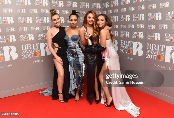 Perrie Edwards, Leigh-Anne Pinnock, Jesy Nelson and Jade Thirlwall of Little Mix pose with their award for Best British Single in the winner's room...