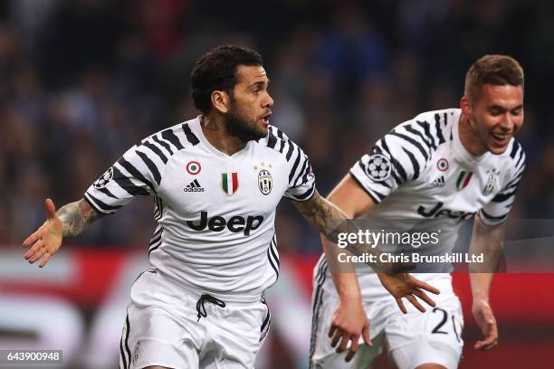 Dani Alves of Juventus celebrates scoring the second goal to make the score 0-2 with Marko Pjaca during the UEFA Champions League Round of 16 first...