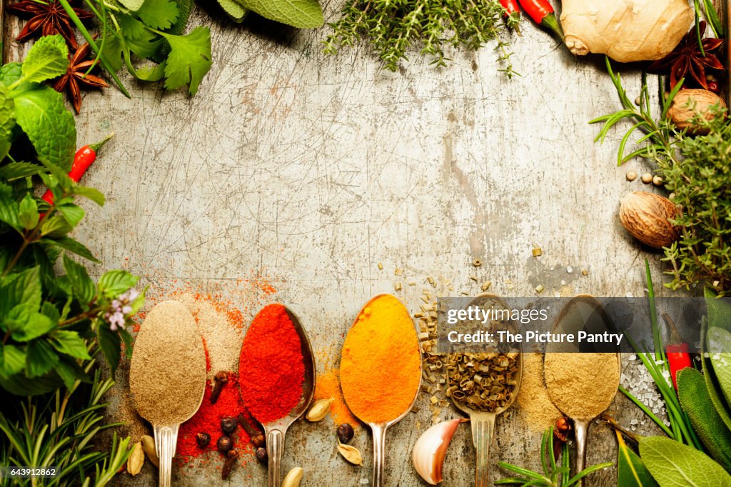 Herbs and spices selection on rustic background - cooking, gardening or vegetarian concept