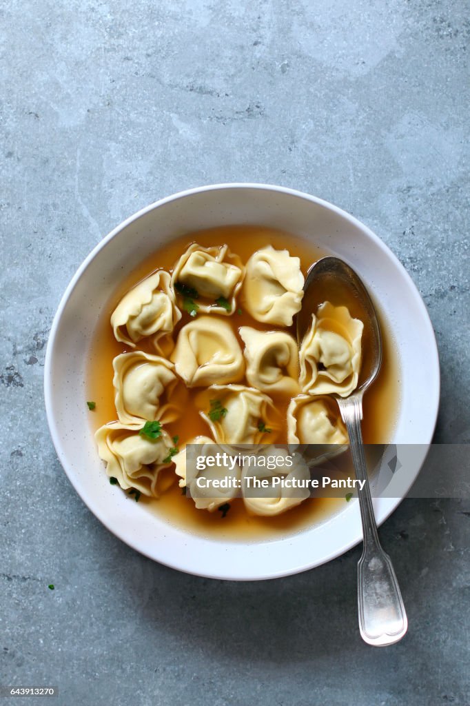 Homemade tortellini in broth.Top view