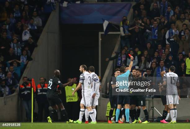 Referee Felix Brych from Germany shows a red card to FC Porto's defender from Brazil Alex Telles during the UEFA Champions League Round of 16 - First...