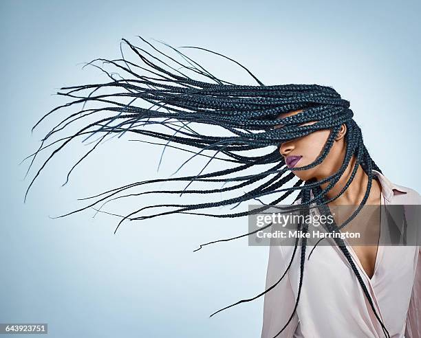 black female flicking hair - black blouse stock pictures, royalty-free photos & images