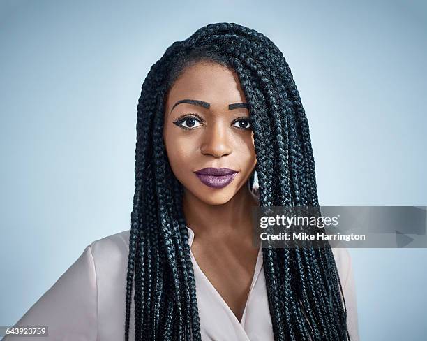portrait of young black female looking to camera - braid hairstyle stock pictures, royalty-free photos & images